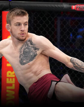 Tom Nolan of Australia kicks Bogdan Grad of Romania in a lightweight fight during Dana White's Contender Series season seven, week one at UFC APEX on August 08, 2023 in Las Vegas, Nevada. (Photo by Al Powers/Zuffa LLC)