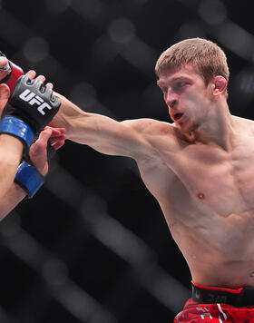 Arnold Allen of England punches Movsar Evloev of Russia in a featherweight bout during the UFC 297 event at Scotiabank Arena on January 20, 2024 in Toronto, Ontario. (Photo by Cooper Neill/Zuffa LLC)