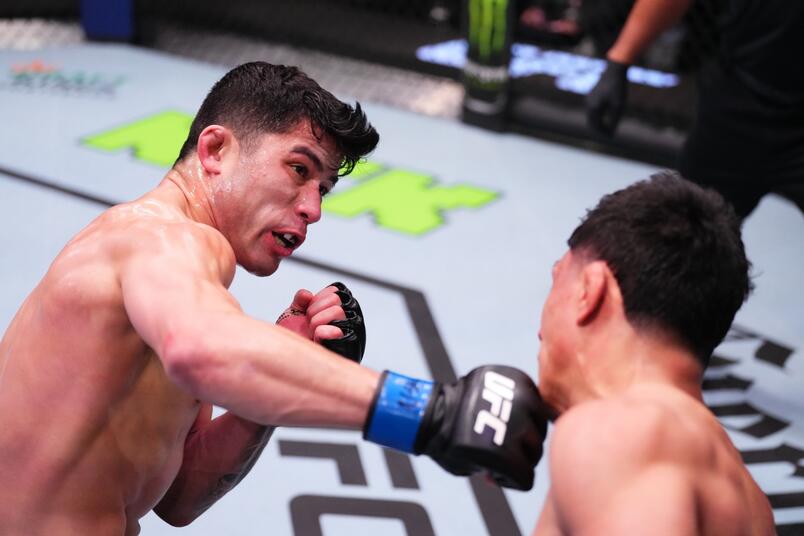 Hyder Amil of the Philippines punches Fernie Garcia in a featherweight fight during the UFC Fight Night event at UFC APEX on February 10, 2024 in Las Vegas, Nevada. (Photo by Jeff Bottari/Zuffa LLC)