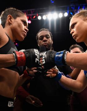 Amanda Nunes of Brazil and Ronda Rousey touch gloves in their UFC women's bantamweight championship bout during the UFC 207 event at T-Mobile Arena on December 30, 2016 in Las Vegas, Nevada. (Photo by Jeff Bottari/Zuffa Getty Images)