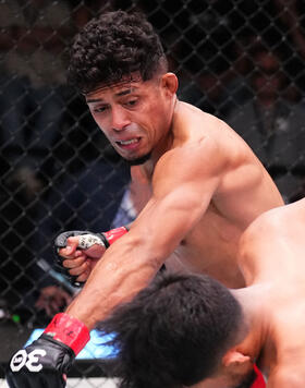 Jonathan Martinez punches Adrian Yanez in a bantamweight fight during the UFC Fight Night event at UFC APEX on October 14, 2023 in Las Vegas, Nevada. (Photo by Chris Unger/Zuffa LLC)