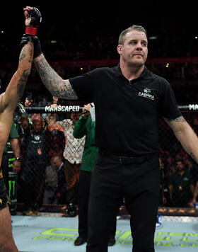 Flyweight Champion Alexandre Pantoja speaks with Daniel Cormier after defending his title at UFC 301. 