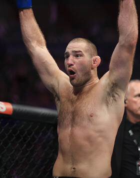 Sean Strickland of United States celebrates victory over Israel Adesanya of Nigeria to become the new middleweight champion of the world during the UFC 293 event at Qudos Bank Arena on September 10, 2023 in Sydney, Australia. (Photo by Mark Evans/Getty Images)