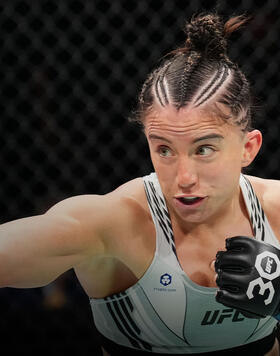 Maycee Barber punches Andrea Lee in a flyweight fight during the UFC Fight Night event at AT&T Center on March 25, 2023 in San Antonio, Texas. (Photo by Josh Hedges/Zuffa LLC)