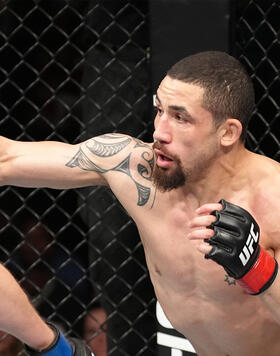 Robert Whittaker of New Zealand punches Marvin Vettori of Italy in a middleweight fight during the UFC Fight Night event at The Accor Arena on September 03, 2022 in Paris, France. (Photo by Jeff Bottari/Zuffa LLC)