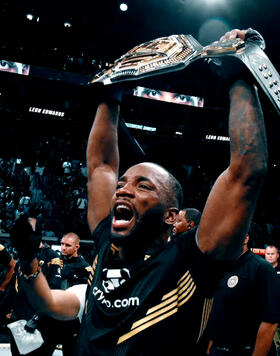 Leon Edwards celebrates after his victory over Kamaru Usman