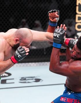 Azamat Murzakanov of Russia punches Alonzo Menifield in a light heavyweight fight during the UFC Fight Night event at Etihad Arena on August 03, 2024 in Abu Dhabi, United Arab Emirates. (Photo by Josh Hedges/Zuffa LLC)