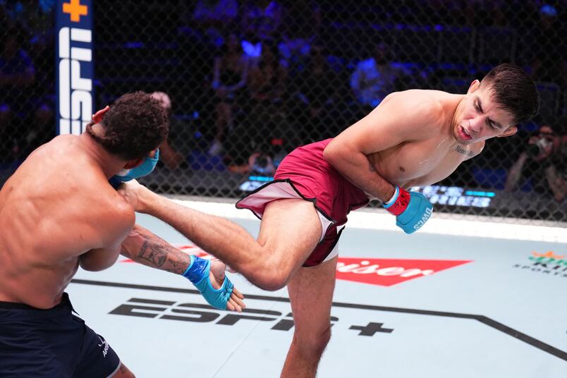 Jose Delgado kicks Ernie Juarez in a featherweight fight during Dana White's Contender Series season eight, week one on August 13, 2024 in Las Vegas, Nevada. (Photo by Chris Unger/Zuffa LLC)