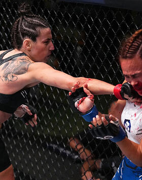 Marina Rodriguez of Brazil punches Michelle Waterson-Gomez in a strawweight fight during the UFC Fight Night event at UFC APEX on September 23, 2023 in Las Vegas, Nevada. (Photo by Chris Unger/Zuffa LLC)