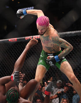 Sean O’Malley throws a punch against Aljamain Sterling during their Bantamweight title fight at UFC 292 at TD Garden on August 19, 2023 in Boston, Massachusetts. (Photo by Paul Rutherford/Getty Images)