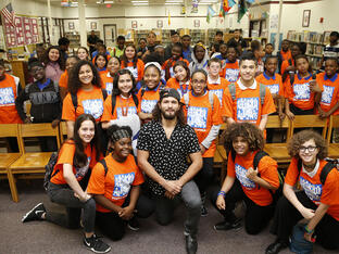 Jorge Masvidal poses with participants of Florida's After-School All-Stars