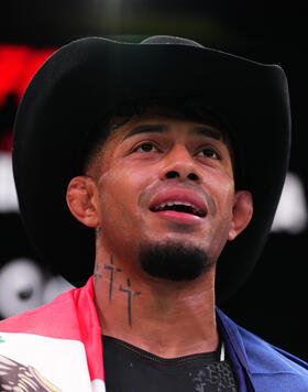 Jonathan Martinez talks with Michael Bisping after his victory at UFC Fight Night: Yusuff vs Barboza. 