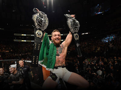 UFC lightweight and featherweight champion Conor McGregor of Ireland celebrates after defeating Eddie Alvarez in their UFC lightweight championship fight during the UFC 205 event at Madison Square Garden on November 12, 2016 in New York City. (Photo by Jeff Bottari/Zuffa LLC)