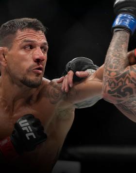 Rafael Dos Anjos of Brazil punches Renato Moicano of Brazil in their 160-pound catchweight fight during the UFC 272 event on March 05, 2022 in Las Vegas, Nevada. (Photo by Chris Unger/Zuffa LLC)