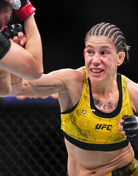 Karol Rosa of Brazil punches Irene Aldana of Mexico in a bantamweight fight during the UFC 296 event at T-Mobile Arena on December 16, 2023 in Las Vegas, Nevada. (Photo by Chris Unger/Zuffa LLC)