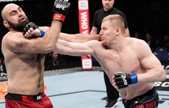  Sergei Pavlovich of Russia punches Shamil Abdurakhimov of Russia in a heavyweight fight during the UFC Fight Night event at O2 Arena on March 19, 2022 in London, England. (Photo by Chris Unger/Zuffa LLC)