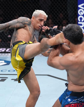 Charles Oliveira of Brazil kicks Beneil Dariush of Iran in their lightweight fight during the UFC 289 event at Rogers Arena on June 10, 2023 in Vancouver, Canada. (Photo by Jeff Bottari/Zuffa LLC)