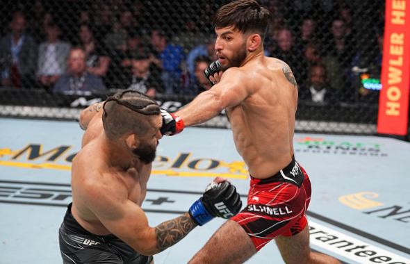 Matt Schnell punches Rogerio Bontorin of Brazil in their bantamweight bout during the UFC 262 event at Toyota Center on May 15, 2021 in Houston, Texas. (Photo by Josh Hedges/Zuffa LLC)