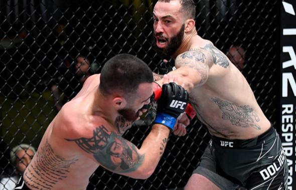 Roman Dolidze of Georgia punches Laureano Staropoli of Argentina in a middleweight fight during the UFC Fight Night event at UFC APEX on June 05, 2021 in Las Vegas, Nevada. (Photo by Jeff Bottari/Zuffa LLC)