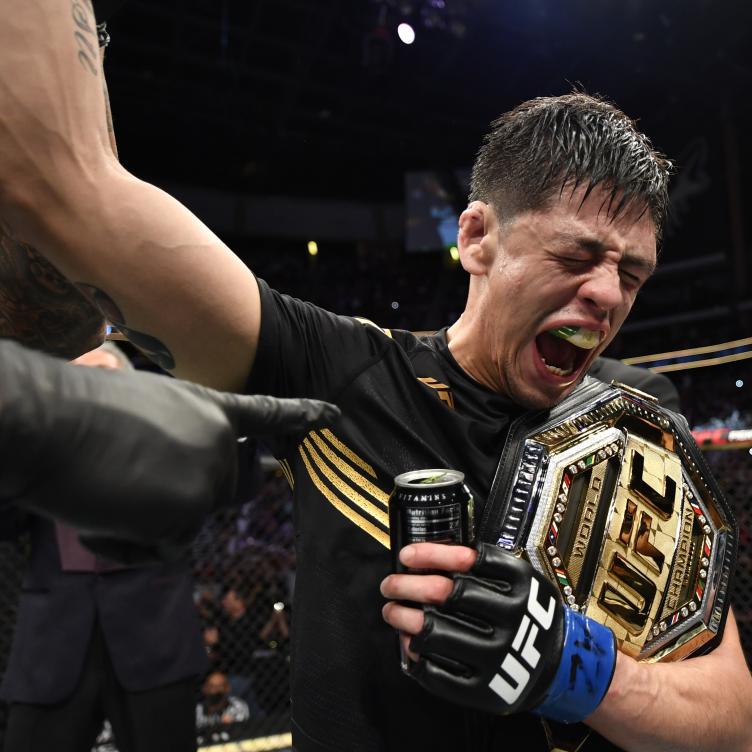 Brandon Moreno of Mexico reacts after submitting Deiveson Figueiredo of Brazil to win the UFC flyweight championship fight during the UFC 263 