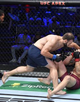 Azamat Murzakanov of Russia punches Matheus Scheffel of Brazil in their light heavyweight fight during Dana White's Contender Series season five week one at UFC APEX on August 31, 2021 in Las Vegas, Nevada. (Photo by Chris Unger/Zuffa LLC)