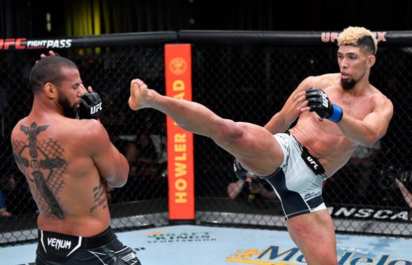 Johnny Walker of Brazil kicks Thiago Santos of Brazil in their light heavyweight bout during the UFC Fight Night event at UFC APEX on October 02, 2021 in Las Vegas, Nevada. (Photo by Jeff Bottari/Zuffa LLC)