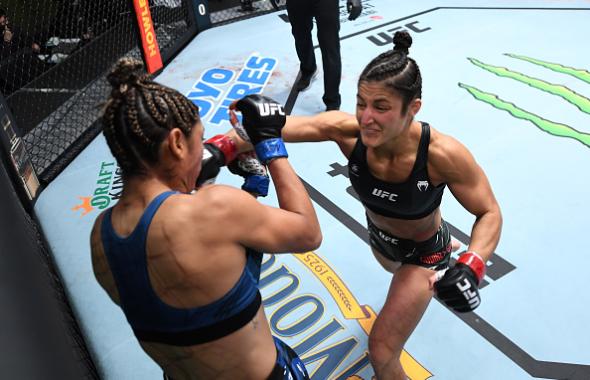 Loopy Godinez punches Silvana Juarez of Argentina in their women's strawweight bout during the UFC Fight Night event at UFC APEX on October 09, 2021 in Las Vegas, Nevada. (Photo by Josh Hedges/Zuffa LLC)