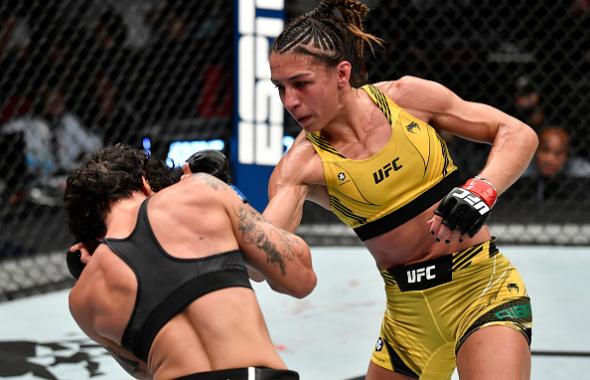 Amanda Ribas of Brazil punches Virna Jandiroba of Brazil in a strawweight fight during the UFC 267 event at Etihad Arena on October 30, 2021 in Yas Island, Abu Dhabi, United Arab Emirates. (Photo by Chris Unger/Zuffa LLC)