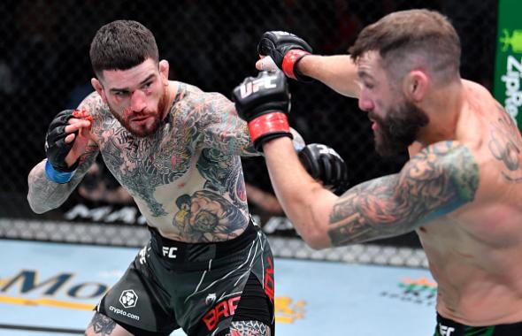 Sean Brady punches Michael Chiesa in a welterweight fight during the UFC Fight Night event at UFC APEX on November 20, 2021 in Las Vegas, Nevada. (Photo by Chris Unger/Zuffa LLC)