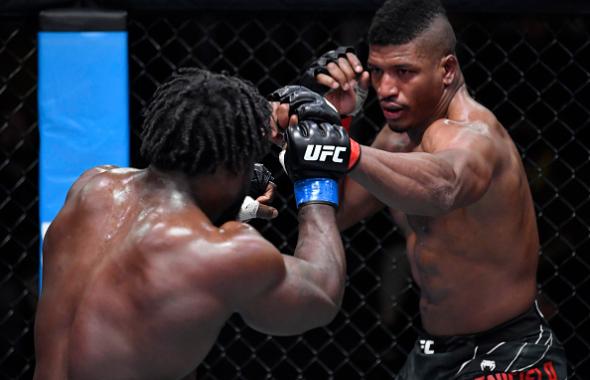 Alonzo Menifield punches William Knight in their light heavyweight fight during the UFC Fight Night event at UFC APEX on December 04, 2021 in Las Vegas, Nevada. (Photo by Jeff Bottari/Zuffa LLC)