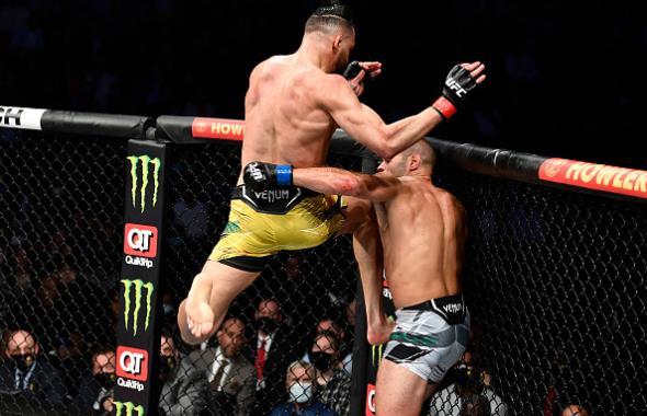 Michel Pereira of Brazil knees Andre Fialho of Portugal in their welterweight fight during the UFC 270 event at Honda Center on January 22, 2022 in Anaheim, California. (Photo by Chris Unger/Zuffa LLC)