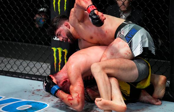 Arman Tsarukyan of Armenia punches Joel Alvarez of Spain in their lightweight fight during the UFC Fight Night event at UFC APEX on February 26, 2022 in Las Vegas, Nevada. (Photo by Chris Unger/Zuffa LLC)