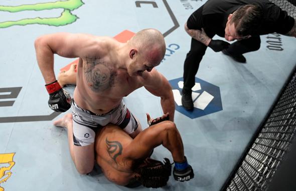 Serghei Spivac of Moldova punches Greg Hardy in their heavyweight fight during the UFC 272 event on March 05, 2022 in Las Vegas, Nevada. (Photo by Jeff Bottari/Zuffa LLC)