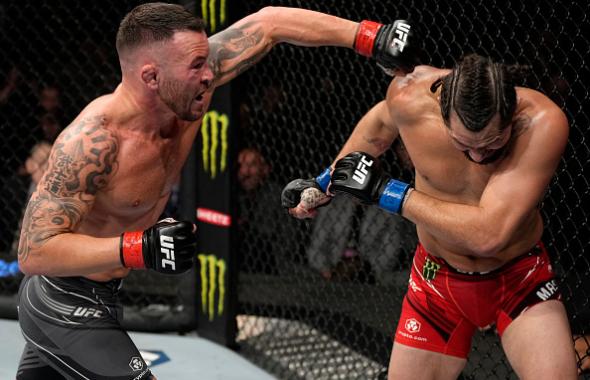 Colby Covington punches Jorge Masvidal in their welterweight fight during the UFC 272 event on March 05, 2022 in Las Vegas, Nevada. (Photo by Jeff Bottari/Zuffa LLC)