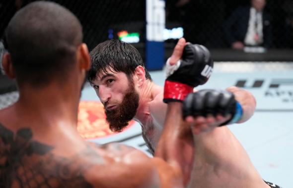 Magomed Ankalaev of Russia punches Thiago Santos of Brazil in their light heavyweight fight during the UFC Fight Night event at UFC APEX on March 12, 2022 in Las Vegas, Nevada. (Photo by Chris Unger/Zuffa LLC)