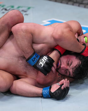 Caio Borralho of Brazil works for a submission against Gadzhi Omargadzhiev of Russia in a middleweight fight during the UFC Fight Night event at UFC APEX on April 16, 2022 in Las Vegas, Nevada. (Photo by Jeff Bottari/Zuffa LLC)