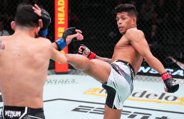 Jonathan Martinez kicks Vince Morales in a bantamweight bout during the UFC Fight Night event at UFC APEX on May 21, 2022 in Las Vegas, Nevada. (Photo by Chris Unger/Zuffa LLC)