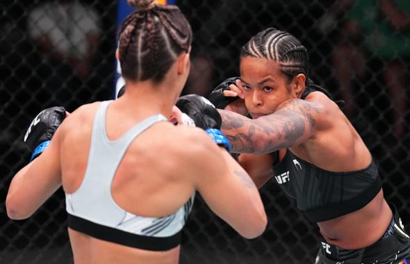 Karine Silva of Brazil punches Poliana Botelho of Brazil in a flyweight fight during the UFC Fight Night event at UFC APEX on June 04, 2022 in Las Vegas, Nevada. (Photo by Chris Unger/Zuffa LLC)