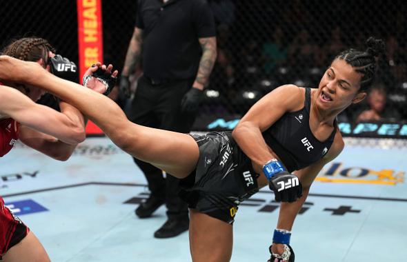 Natalia Silva of Brazil kicks Jasmine Jasudavicius of Canada in a flyweight fight during the UFC Fight Night event at Moody Center on June 18, 2022 in Austin, Texas. (Photo by Josh Hedges/Zuffa LLC)