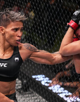 Amanda Lemos of Brazil punches Marina Rodriguez of Brazil in a strawweight fight during the UFC Fight Night event at UFC APEX on November 05, 2022 in Las Vegas, Nevada. (Photo by Chris Unger/Zuffa LLC)