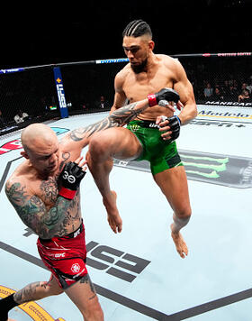 Johnny Walker of Brazil knees Anthony Smith in their light heavyweight fight during the UFC Fight Night event at Spectrum Center on May 13, 2023 in Charlotte, North Carolina. (Photo by Jeff Bottari/Zuffa LLC)