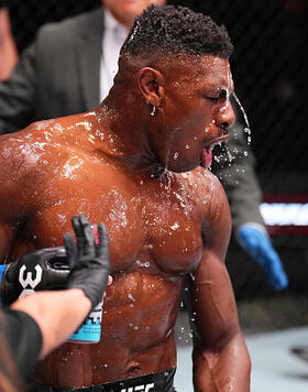 Joaquin Buckley reacts by pouring a bottle of Prime Hydration over himself after knocking out Andre Fialho of Portugal in a welterweight fight during the UFC Fight Night event at UFC APEX on May 20, 2023 in Las Vegas, Nevada. (Photo by Chris Unger/Zuffa LLC)