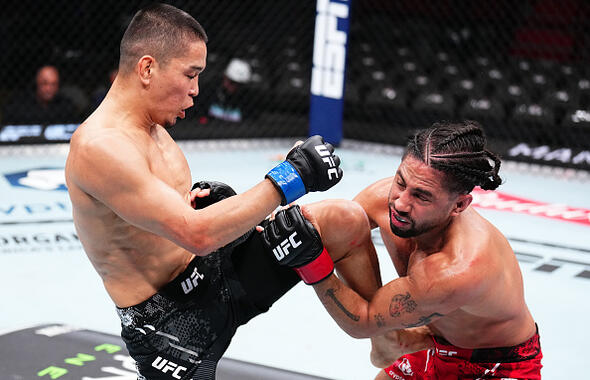 Asu Almabayev of Kazakstan knees CJ Vergara in a flyweight fight during the UFC 299 event at Kaseya Center on March 09, 2024 in Miami, Florida. (Photo by Chris Unger/Zuffa LLC)