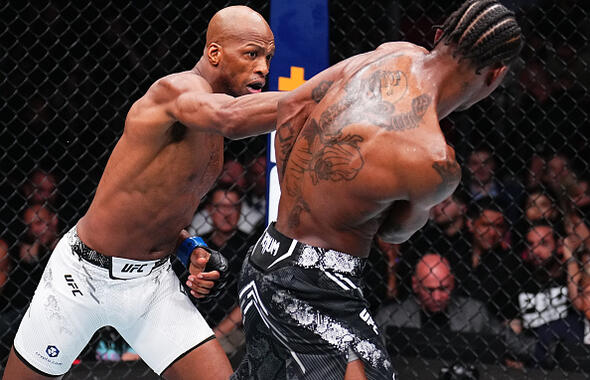 Michael 'Venom' Page of England punches Kevin Holland in a welterweight fight during the UFC 299 event at Kaseya Center on March 09, 2024 in Miami, Florida. (Photo by Chris Unger/Zuffa LLC)