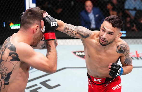 Alex Perez punches Matheus Nicolau of Brazil in a flyweight bout during the UFC Fight Night event at UFC APEX on April 27, 2024 in Las Vegas, Nevada. (Photo by Chris Unger/Zuffa LLC)