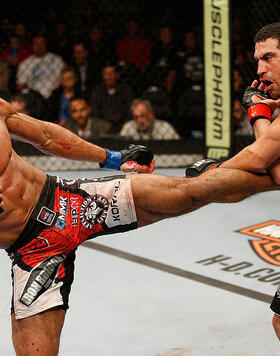 Edson Barboza kicks Danny Castillo in their lightweight bout during the UFC on FOX event at Sleep Train Arena on December 14, 2013 in Sacramento, California. (Photo by Josh Hedges/Zuffa LLC/Zuffa LLC)