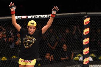 FAIRFAX, VA - APRIL 04:  Juliana Pena celebrates after defeating Milana Dudieva in their women's bantamweight fight during the UFC Fight Night event at the Patriot Center on April 4, 2015 in Fairfax, Virginia. (Photo by Josh Hedges/Zuffa LLC via Getty Images)