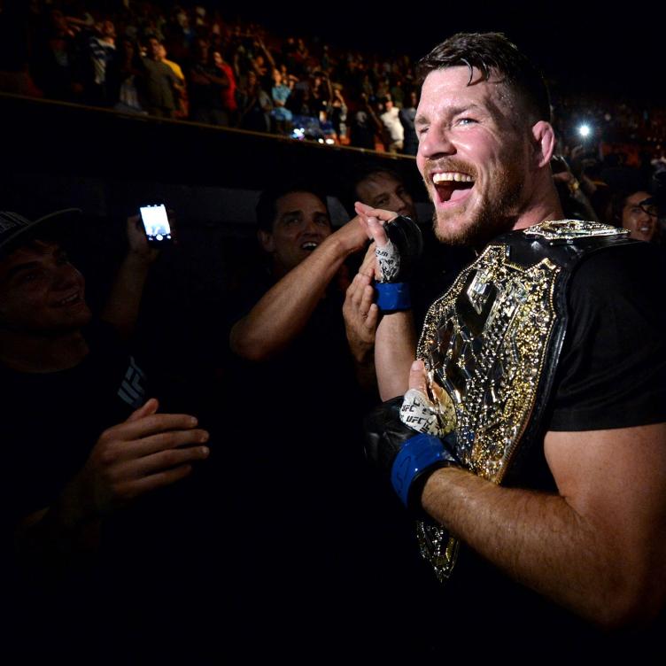 Michael Bisping of England celebrates with his title belt after his first round knockout win against Luke Rockhold during the UFC 199 event at The Forum on June 4, 2016 in Inglewood, California. (Photo by Brandon Magnus/Zuffa LLC)