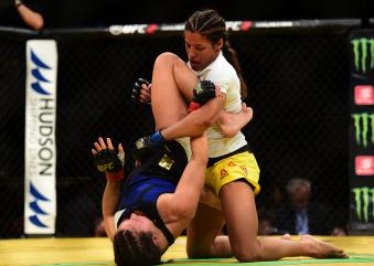 Julianna Pena fights Cat Zigano in their women's bantamweight bout during the UFC 200 event on July 9, 2016 at T-Mobile Arena in Las Vegas, Nevada.