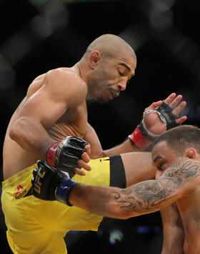 Jose Aldo knees Frankie Edgar during the UFC 200 event at T-Mobile Arena on July 9, 2016 in Las Vegas, Nevada. (Photo by Rey Del Rio/Getty Images)